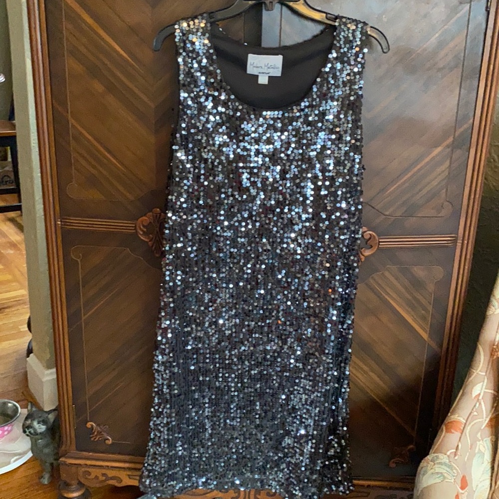 Sequined soft black evening dress.
